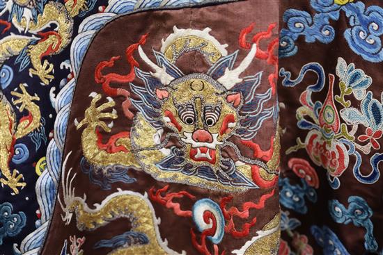 A Chinese embroidered silk and gold thread dragon jacket, late Qing dynasty, alterations